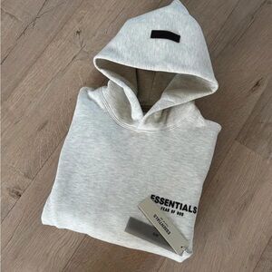 Essentials Light Gray Pullover Hoodie with clear Chest Logo